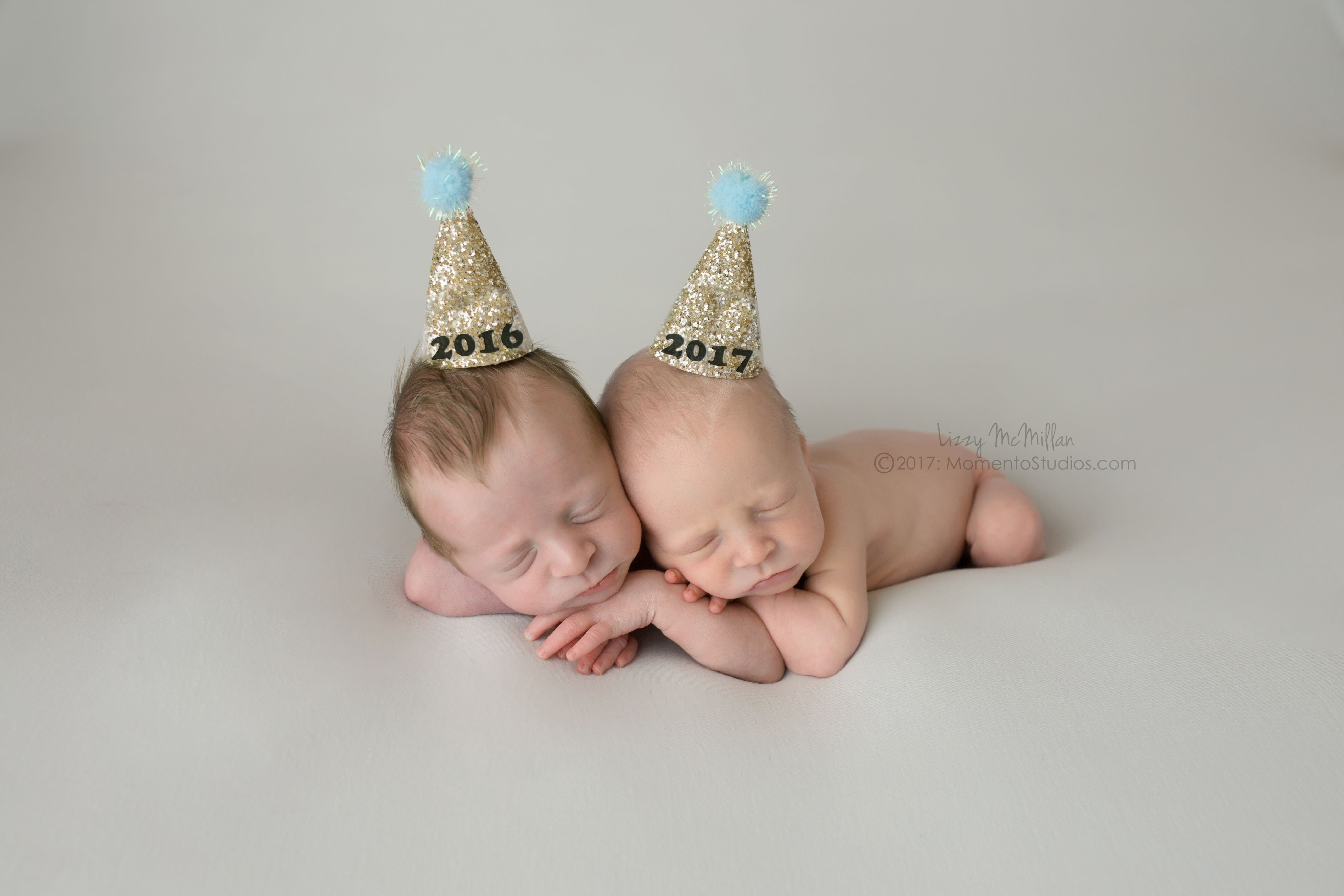 newborn twin babies tiny hats new years babies 