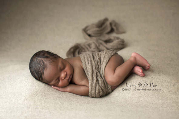 african american newborn boy mohair wrap side lying newborn photo neutral backdrop 